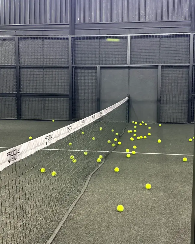Balls scattered across the court after a drilling session