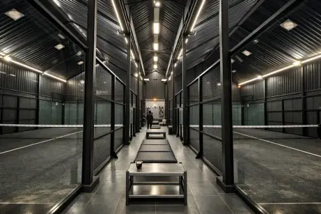 Corridor between glass courts