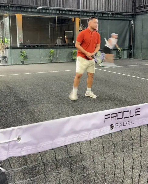 A player at the net on a Paddle Padel court